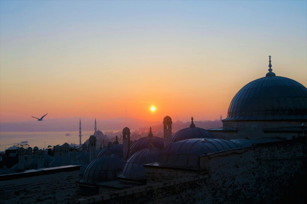 pexels-photo-2236674-2236674 Beautiful view of Istanbul's mosques at sunset with vibrant sky and silhouettes.